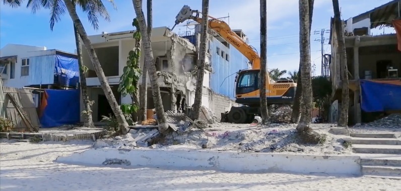 Demolition of buildings along the beach front of White Beach, Boracay
